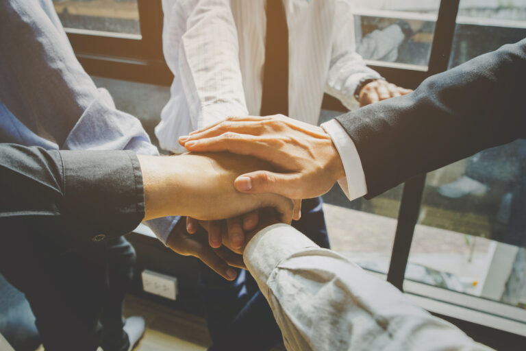 Business team joining hands